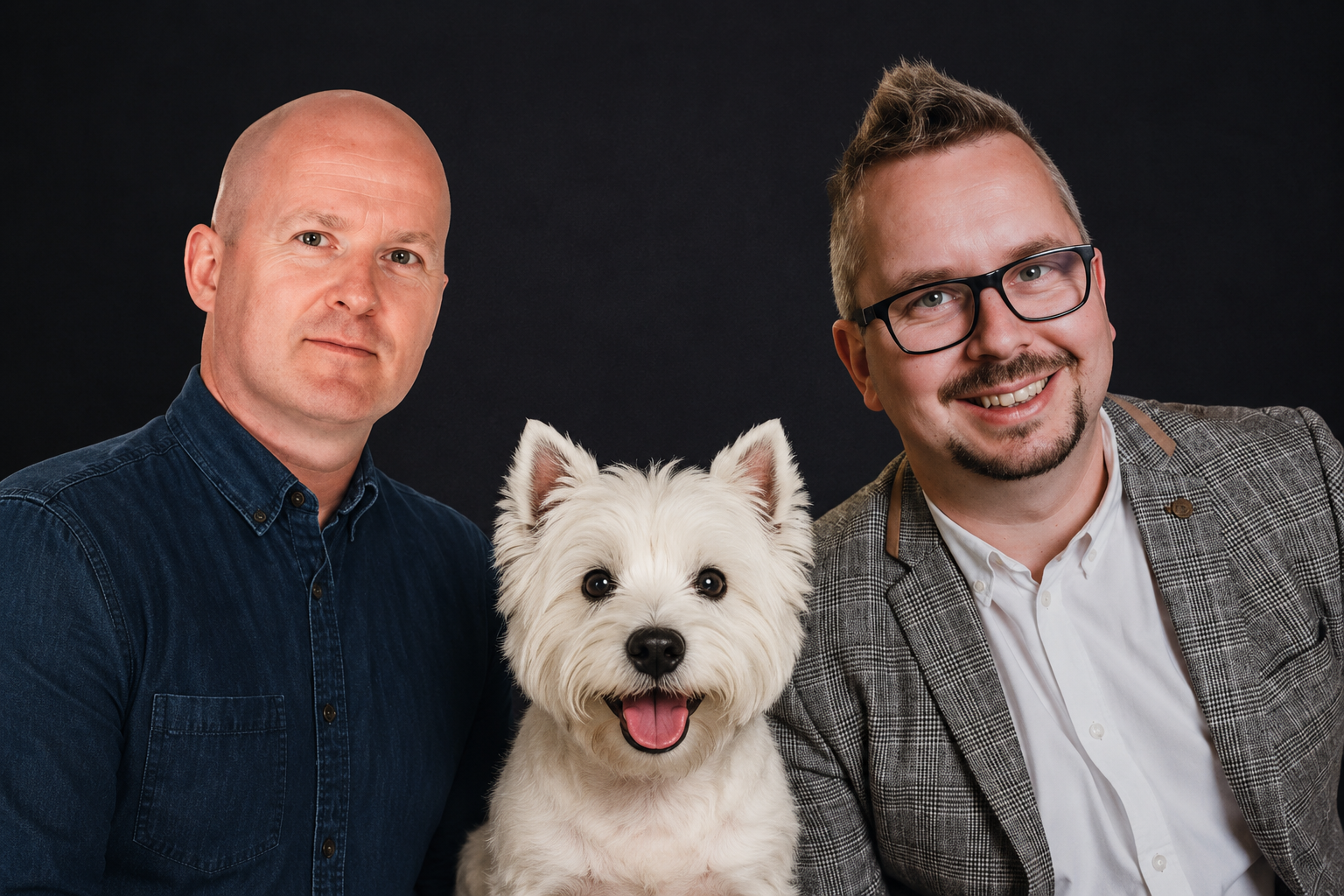 Two men pose together with a happy white West Highland Terrier dog between them, against a dark background. One man wears a denim shirt, the other a checked blazer and glasses. Marketing Made Clear